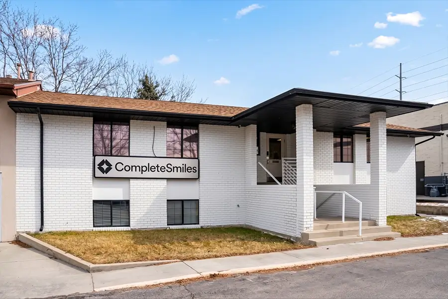 The Complete Smiles Redwood office, a white brick building with a Complete Smiles sign | Complete Smiles-Cottonwood Heights-Mountain View-Redwood-Utah