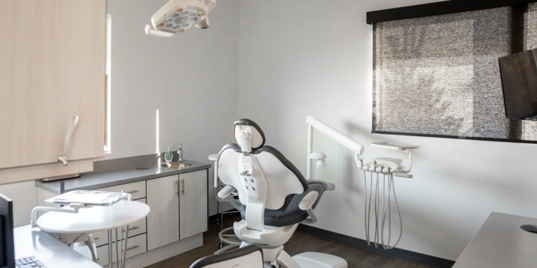 Mountain View treatment room with a computer workstation beside the chair | Complete Smiles-Cottonwood Heights-Mountain View-Redwood-Utah