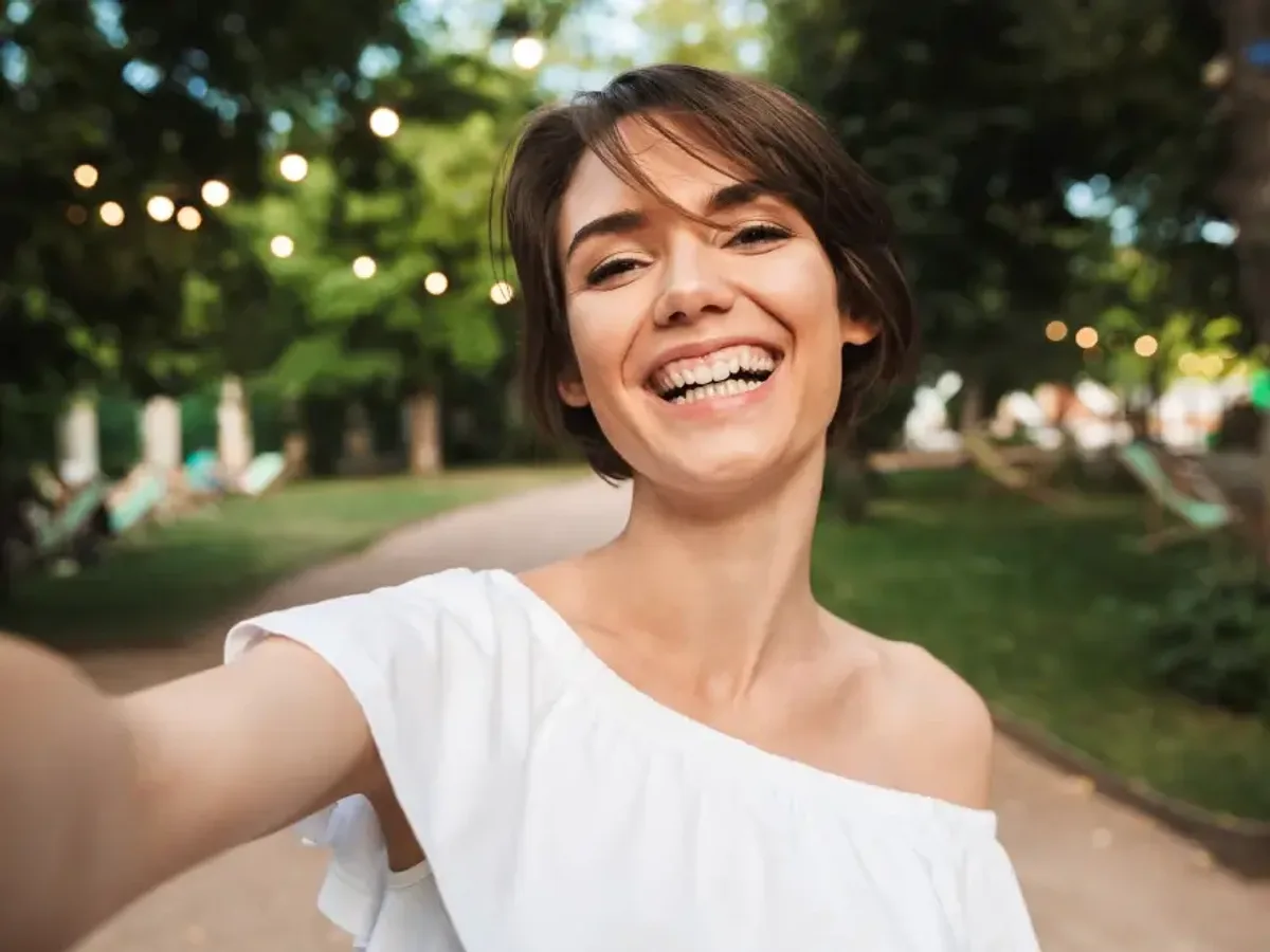 A young woman smiling after cosmetic dental treatment | Complete Smiles-Cottonwood Heights-Mountain View-Redwood-Utah