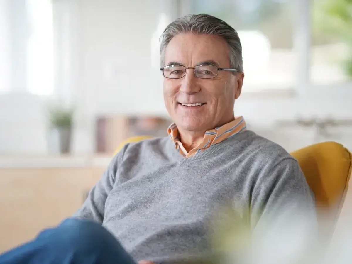 A smiling older man seated at home | Complete Smiles-Cottonwood Heights-Mountain View-Redwood-Utah
