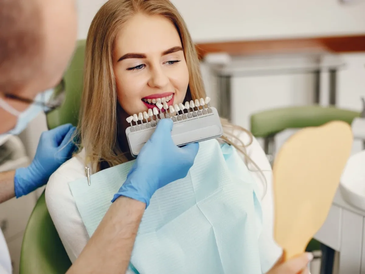A woman smiling with newly placed porcelain veneers | Complete Smiles-Cottonwood Heights-Mountain View-Redwood-Utah