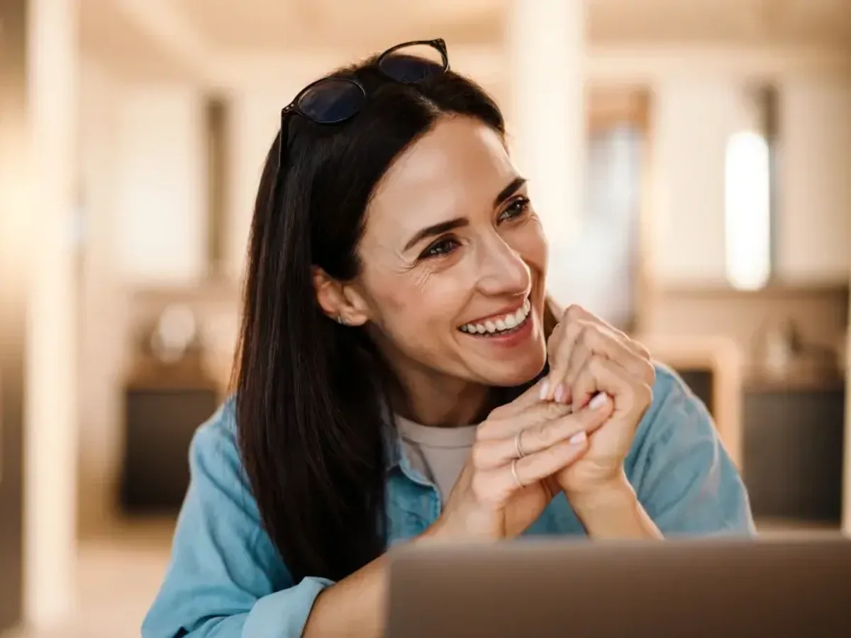 A woman in her forties smiling confidently | Complete Smiles-Cottonwood Heights-Mountain View-Redwood-Utah