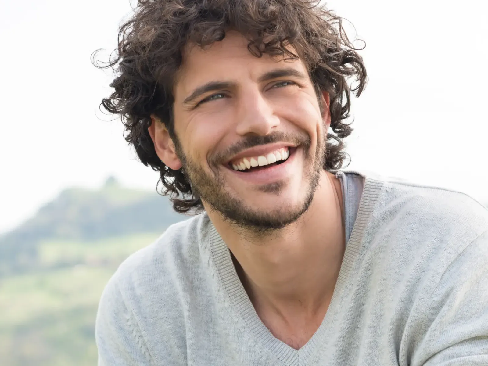 A man with a bright smile outdoors | Complete Smiles-Cottonwood Heights-Mountain View-Redwood-Utah